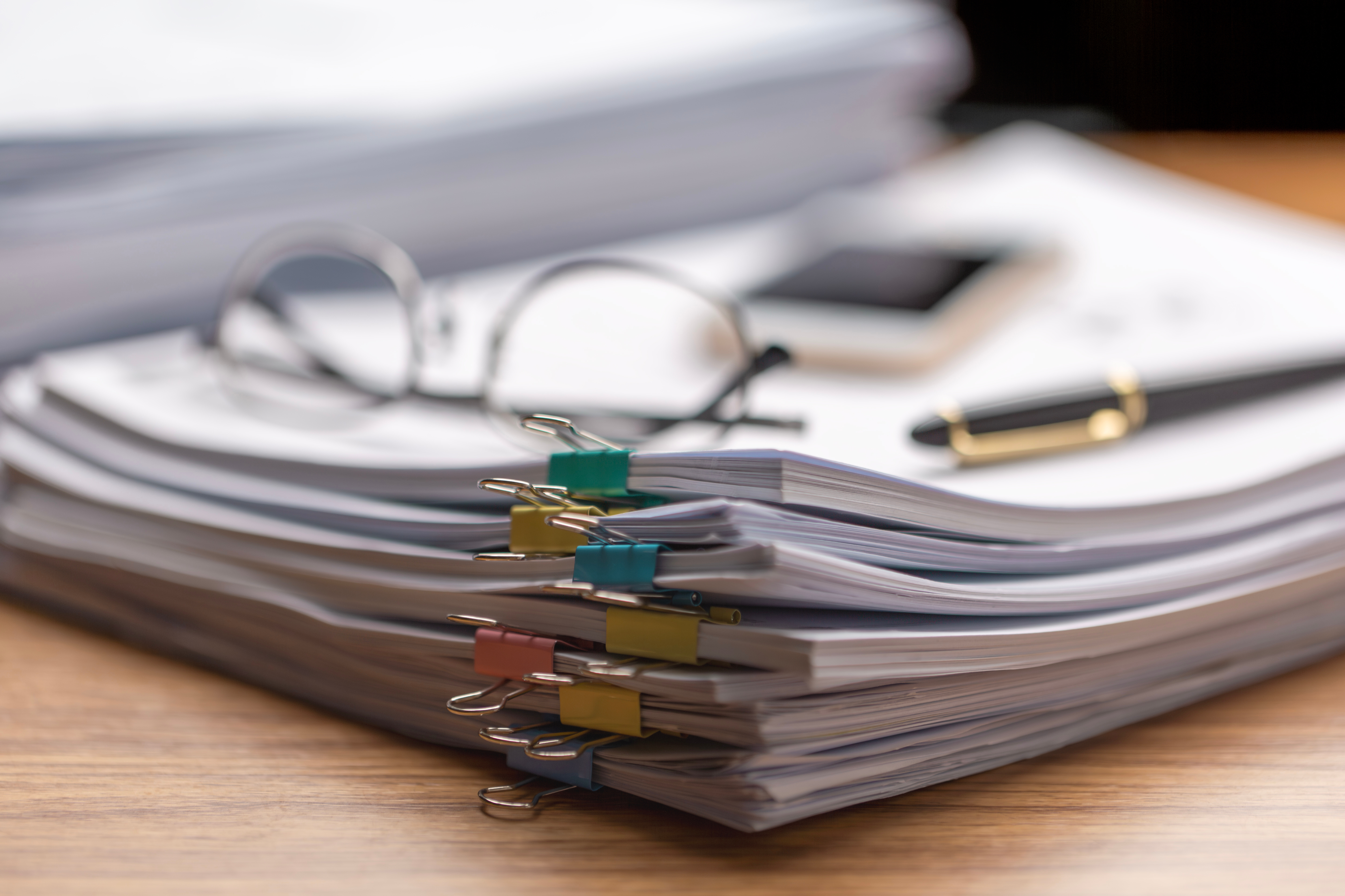 Pile of paperwork on office desk, Messy office workplace, Piles of papers, documents, numerous tasks waiting to be completed , chaotic array of ideas.